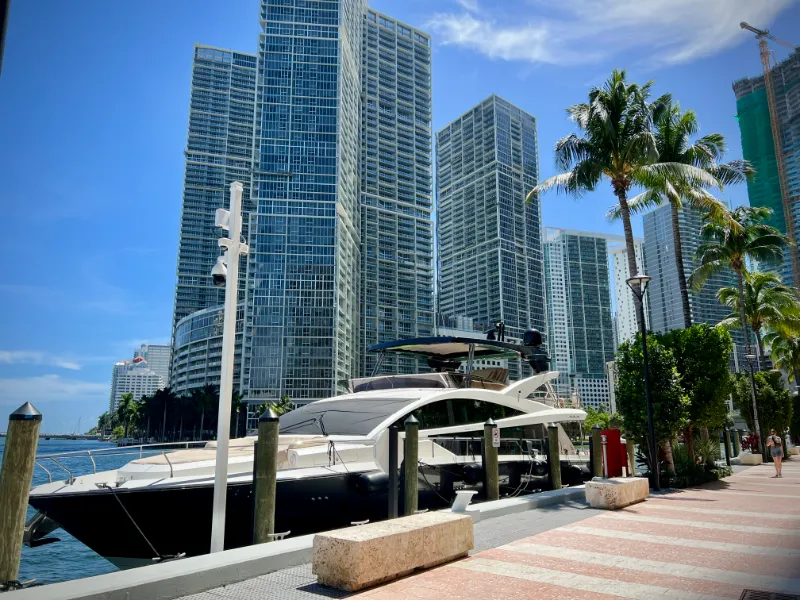 Yacht moored on the Downtown Miami waterfront below residential towers