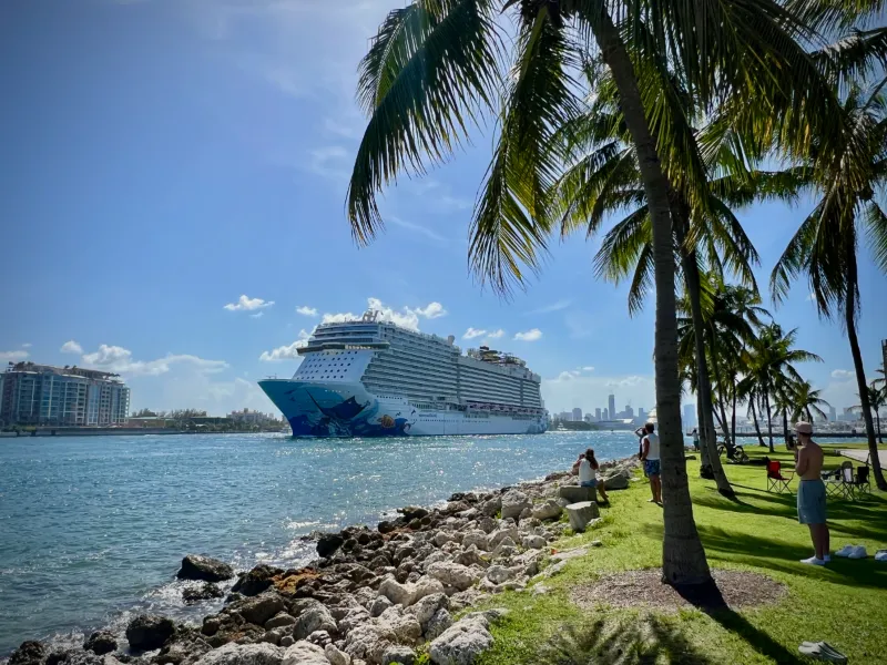Norwegian Escape cruise ship leaving PortMiami through Government Cut, seen from South Pointe Park