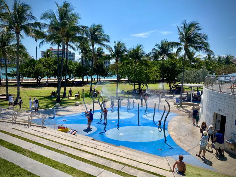Splash pad at South Pointe Park with Fisher Island behind, Miami Beach