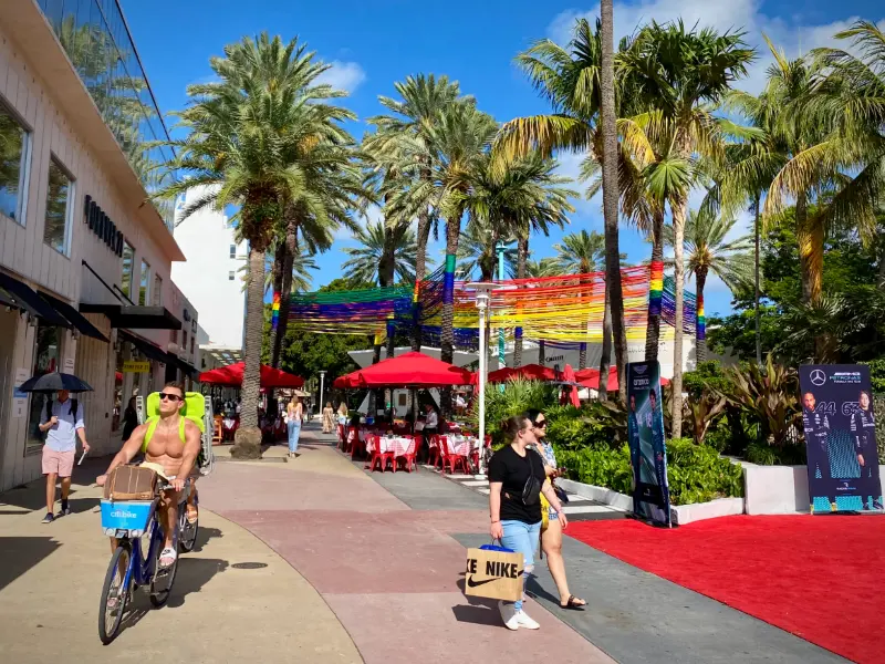 Lincoln Road pedestrian mall with palms and café umbrellas, South Beach, Miami Beach