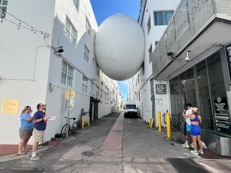 The Betsy Orb suspended over an alley off Ocean Drive, South Beach, Miami Beach